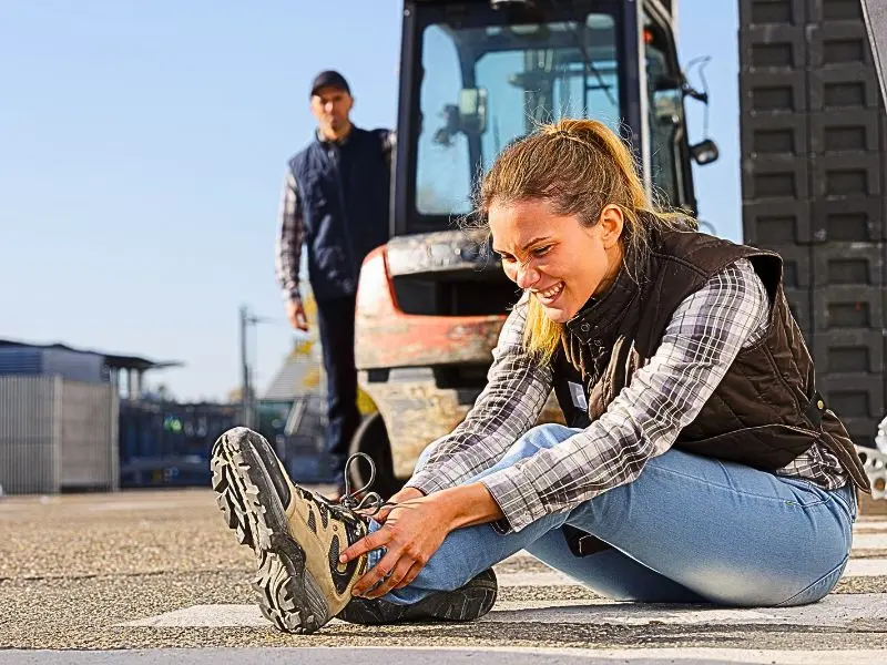 woman worker feeling pain in ankle after work accident social security disability after workers' comp settlement