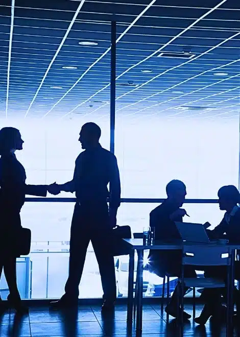 silhouettes of businesspeople interacting background business centre